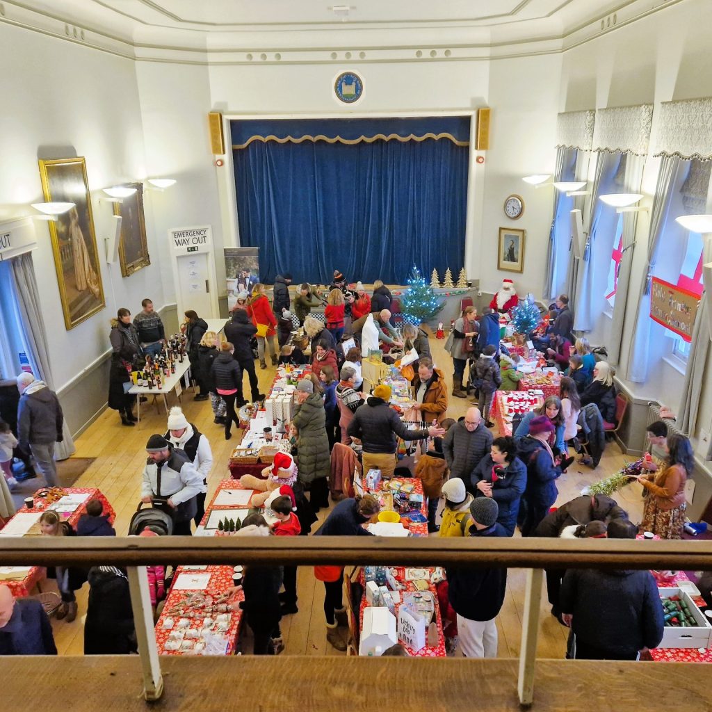 People inside the Town Hall enjoying the Christmas Market