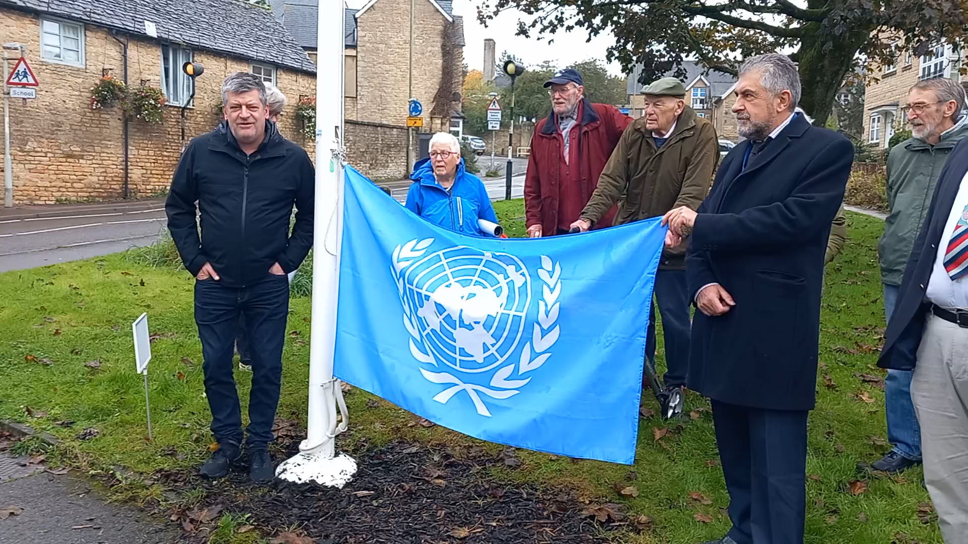 Members of Chipping Norton Amnesty and Chipping Norton Town Council with the UN flag